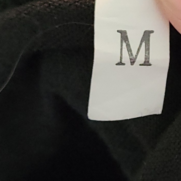 Women's size medium black cold shoulder style tunic top w/ gold cross - Picture 5 of 5